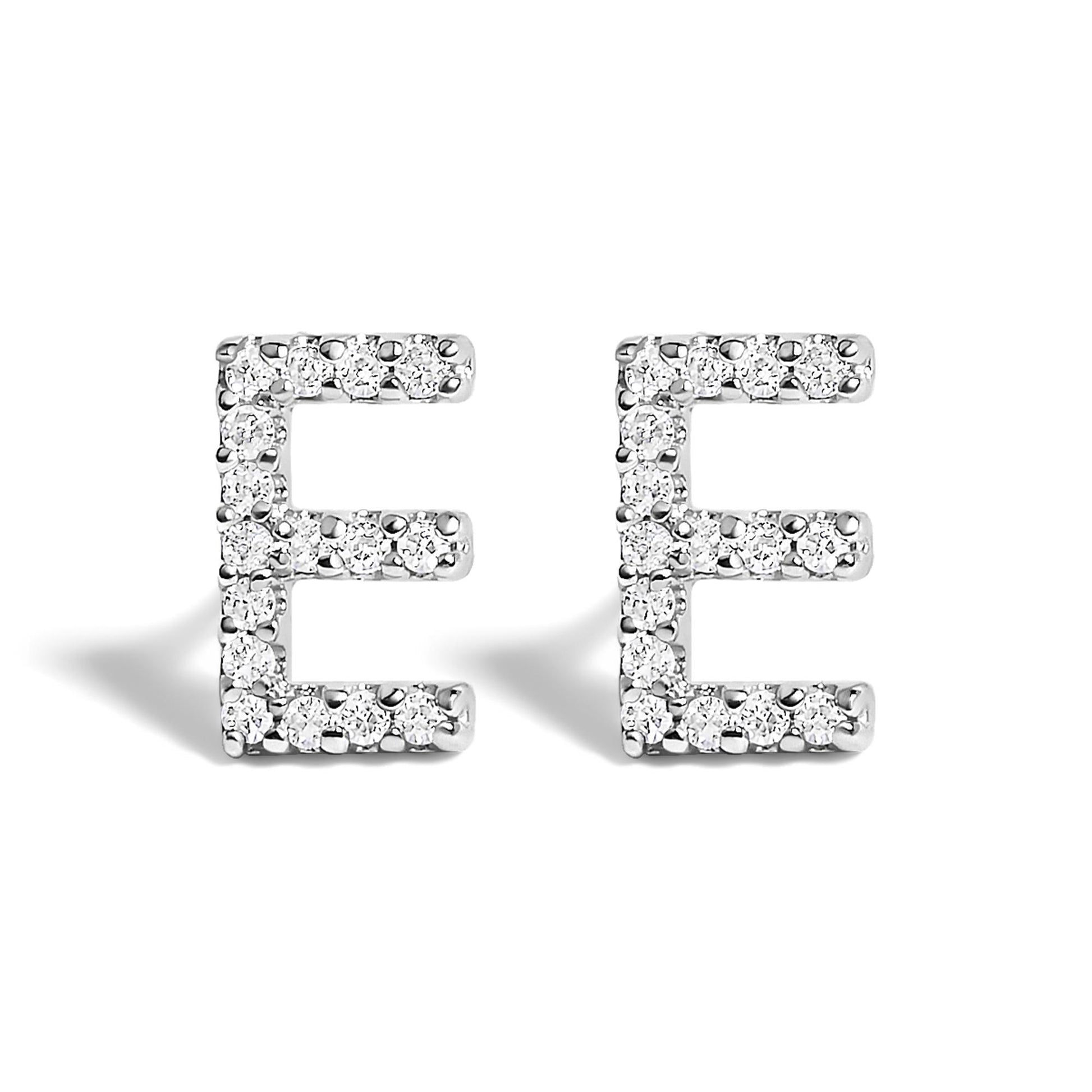 Front view of a pair of white metal earrings shaped like the letter E, each adorned with multiple round white gemstones in a micro-pave setting.