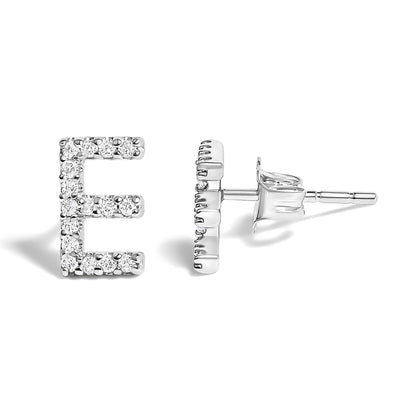 Close-up front and side view of white metal stud earrings shaped like the letter E, adorned with round white gemstones in a micro-pave setting.