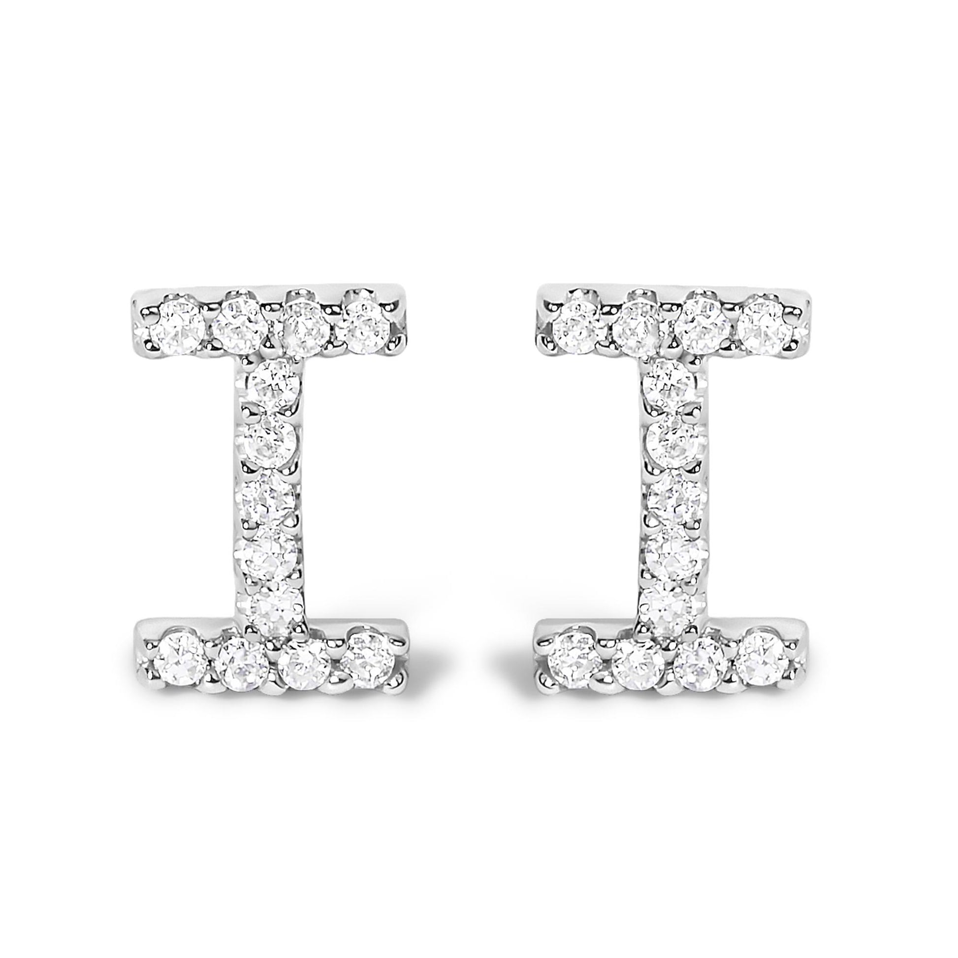 Pair of white metal earrings shown from the front, designed in an I shape and set with round white gemstones in a micro-pave setting.
