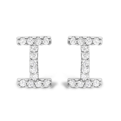 Pair of white metal earrings shown from the front, designed in an I shape and set with round white gemstones in a micro-pave setting.