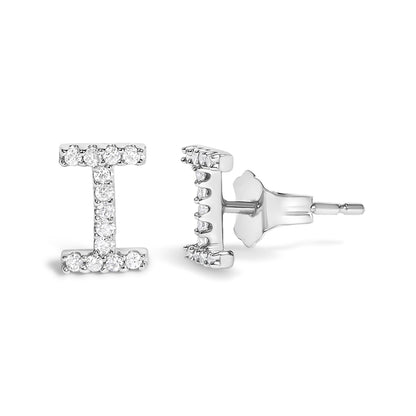 Pair of white metal stud earrings shaped like the letter 'I,' each set with round white gemstones in a micro-pave setting, shown from front and side angles.