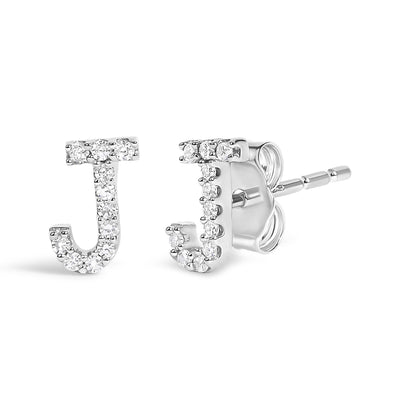 Close-up front and side view of white metal letter J stud earrings with round white gemstones in micro-pave setting.