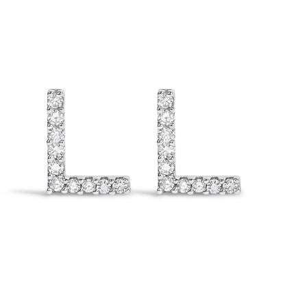 Pair of white metal L-shaped earrings with round white gemstones set in a micro-pave style, shown from the front on a white background.
