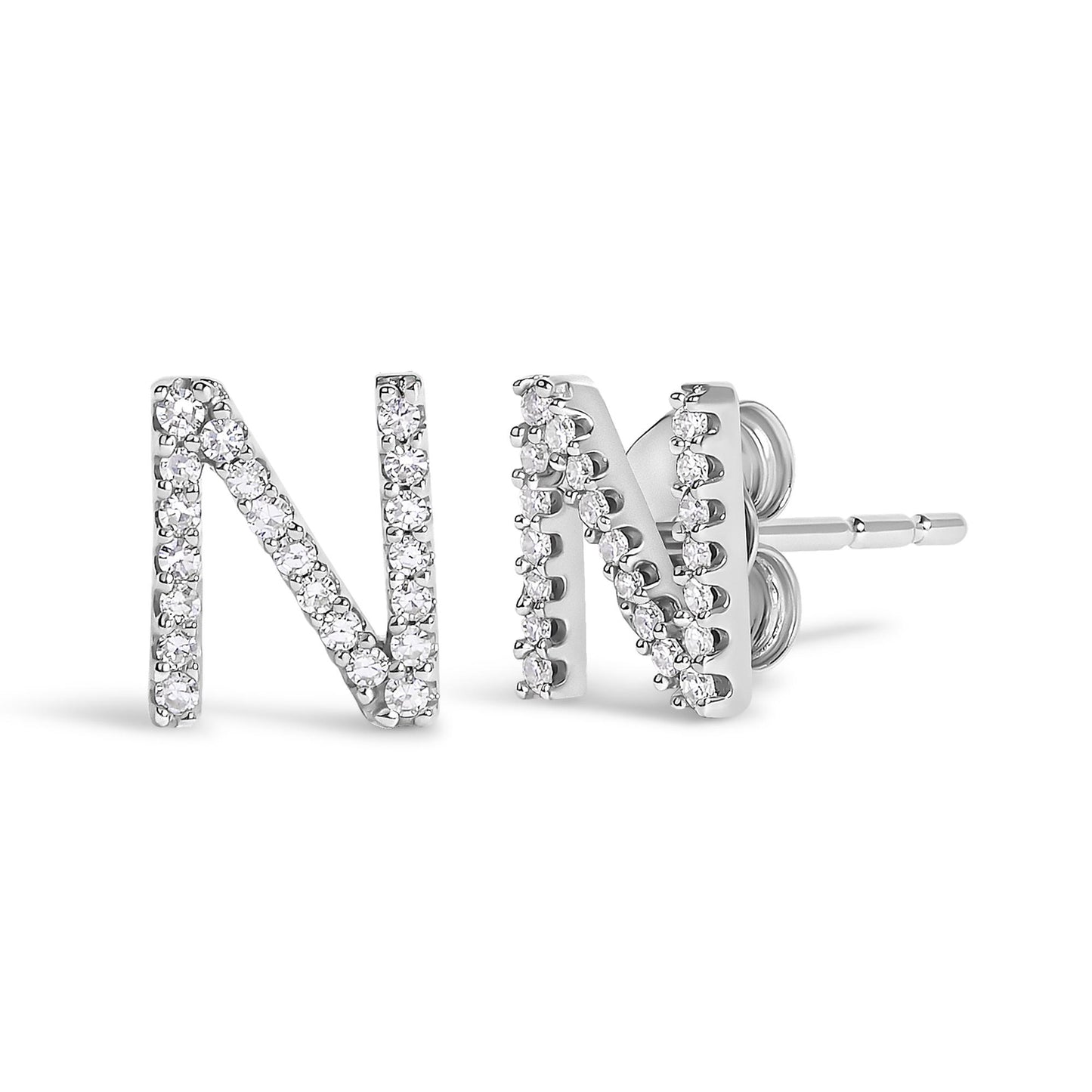 Close-up front and side view of a pair of white metal stud earrings shaped as the letter N, adorned with round white gemstones in a micro-pave setting.
