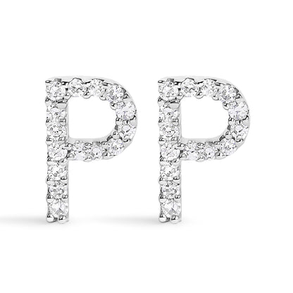 Close-up front view of a pair of white metal earrings shaped like the letter P, each encrusted with round white gemstones in a micro-pave setting.