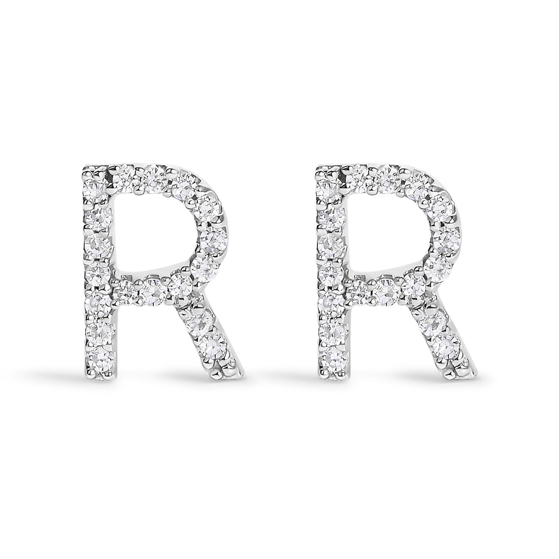 Front view of a pair of white metal earrings in the shape of the letter R, each adorned with round white gemstones in a micro-pave setting.