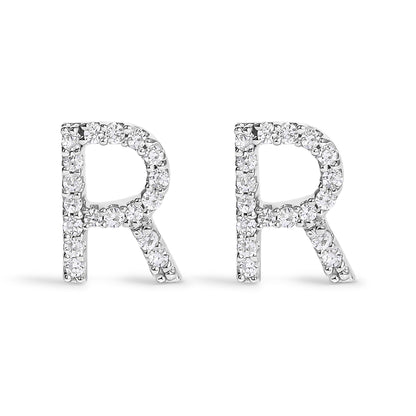 Front view of a pair of white metal earrings in the shape of the letter R, each adorned with round white gemstones in a micro-pave setting.