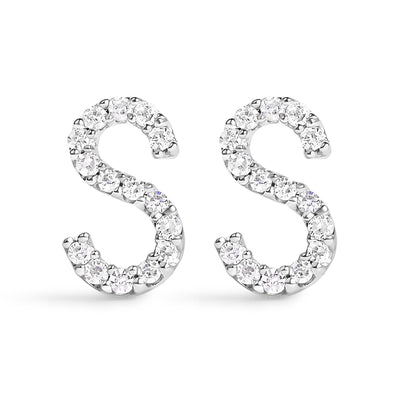 Pair of white metal earrings shaped like the letter S, set with round white gemstones in a micro-pave setting, shown from the front angle on a white background.