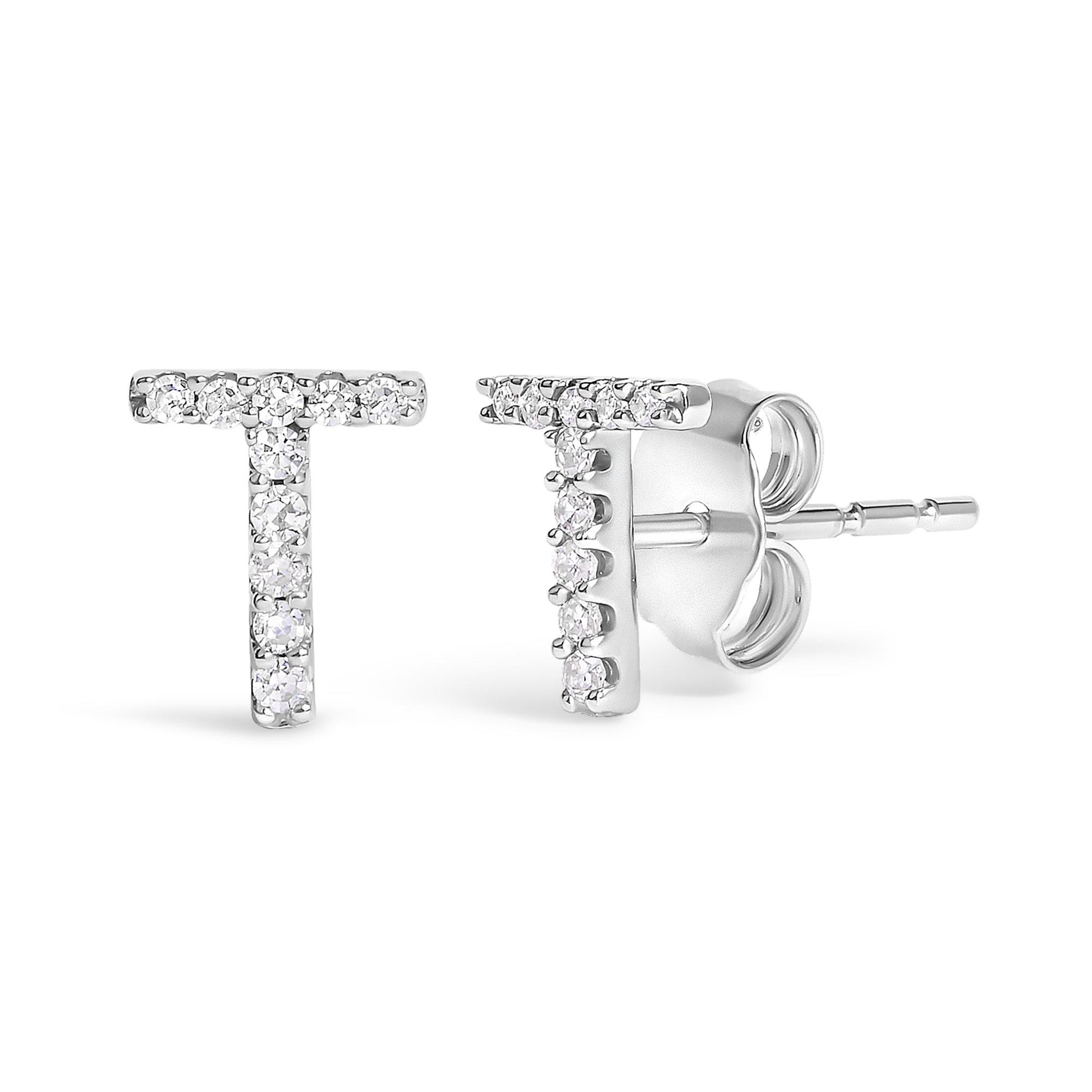 Close-up front and side view of white metal T-shaped earrings with round white gemstones in micro-pave setting.