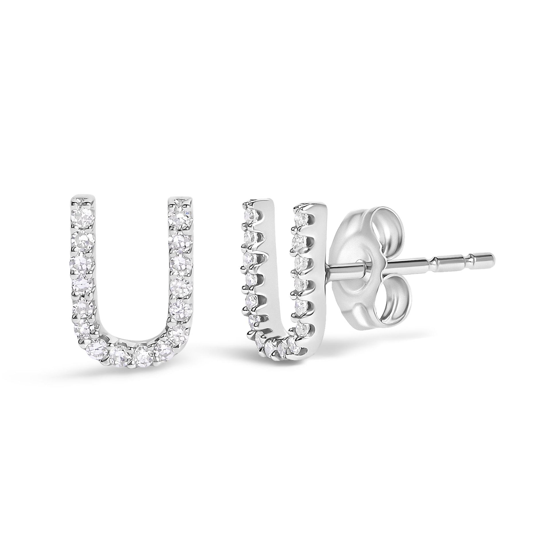 Close-up front and side view of a pair of white metal U-shaped stud earrings set with multiple white round gemstones in a micro-pave setting on a plain white background.