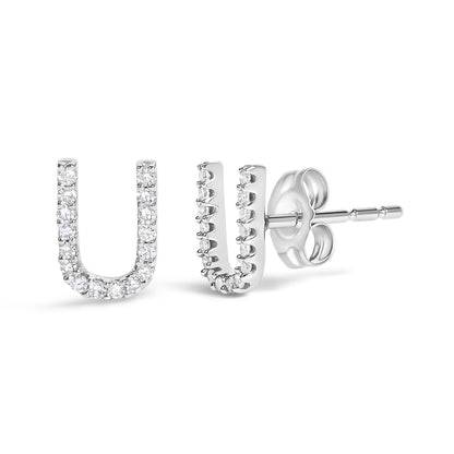 Close-up front and side view of a pair of white metal U-shaped stud earrings set with multiple white round gemstones in a micro-pave setting on a plain white background.