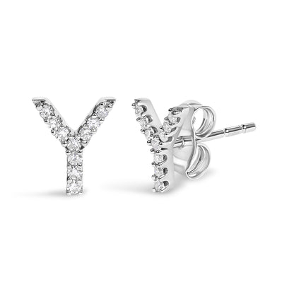 Close-up front and side angled view of white metal stud earrings shaped like the letter Y, featuring multiple round white gemstones in a micro-pave setting.