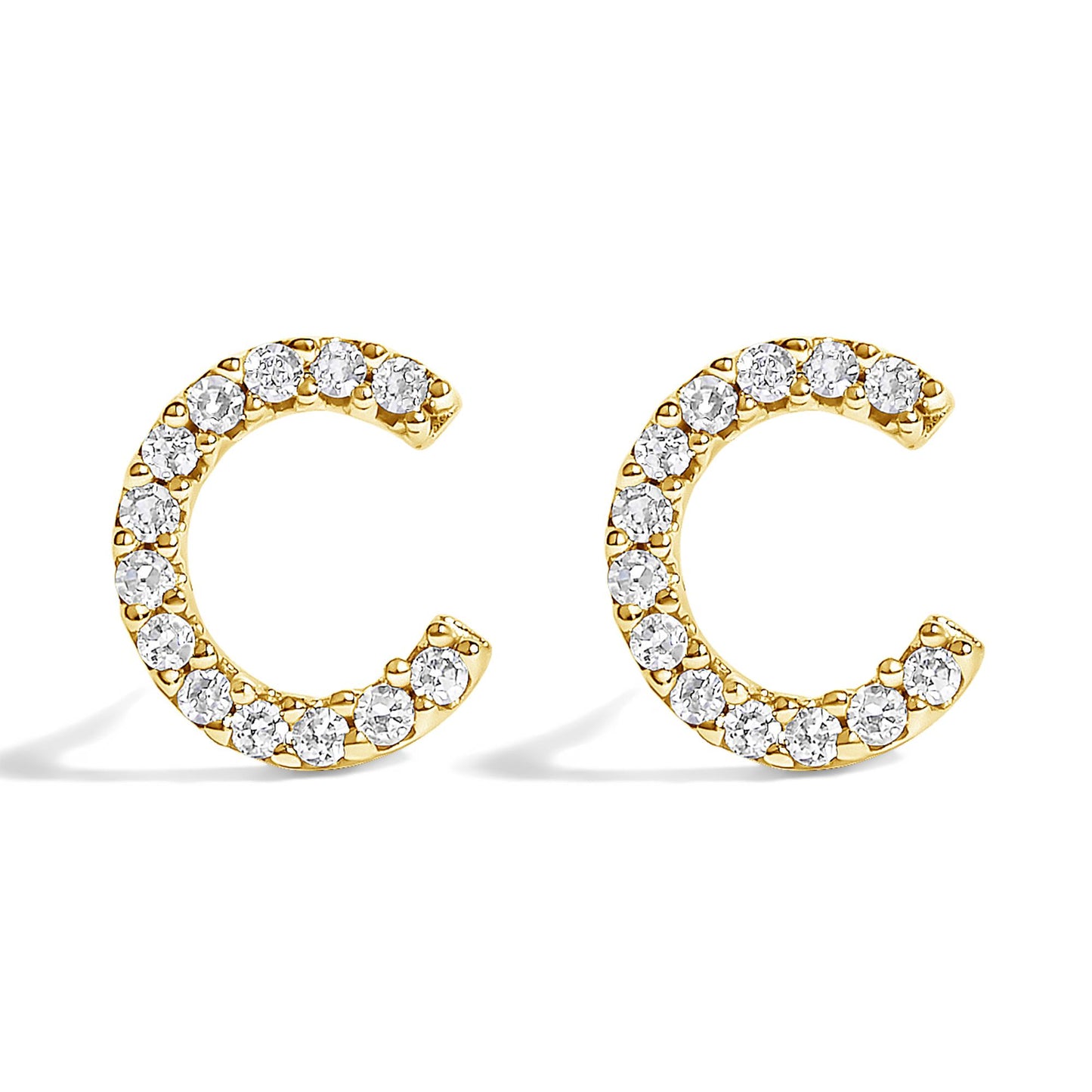 Pair of yellow metal earrings shaped like open circles, adorned with white round gemstones in a micro-pave setting, shown in a front-facing angle on a white background.