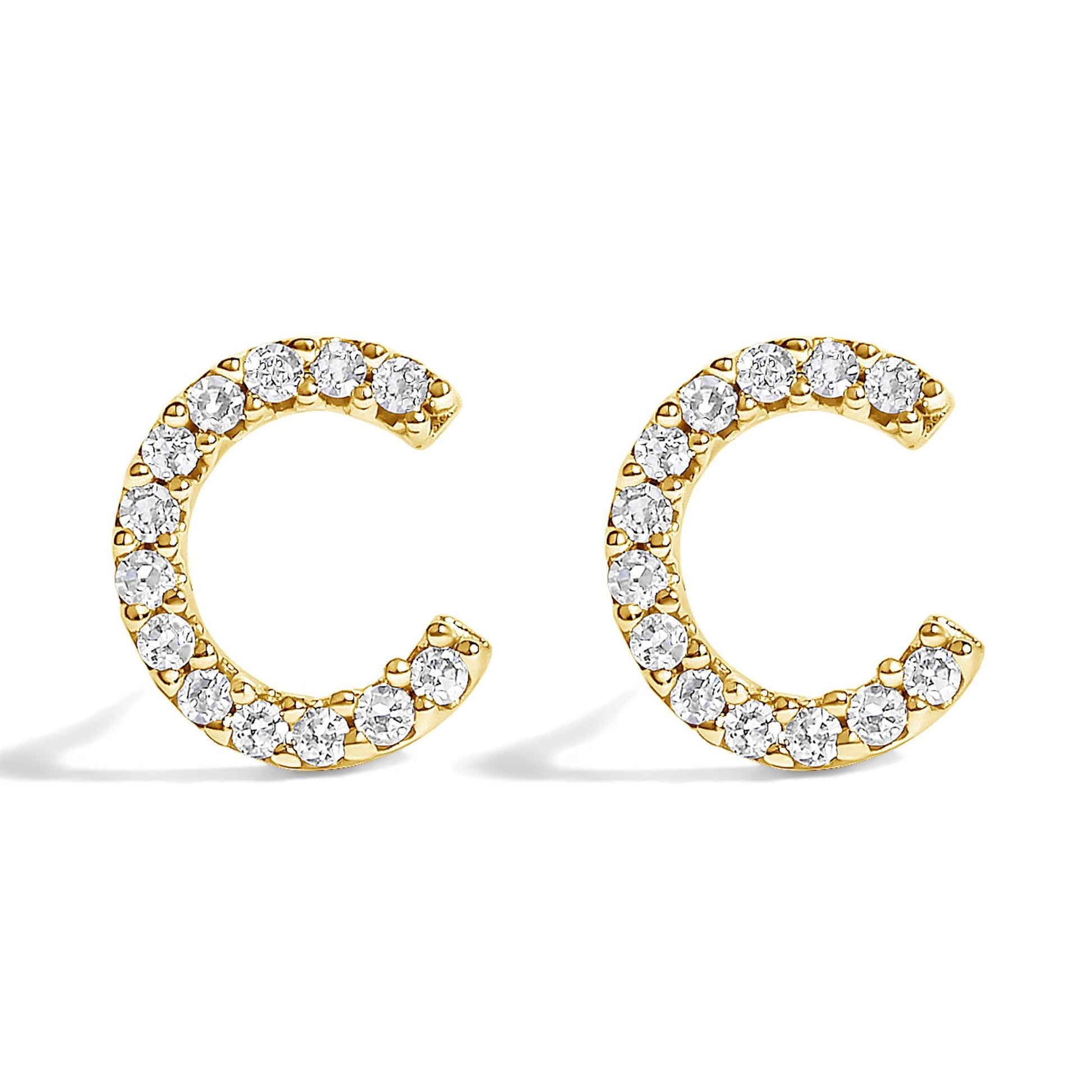 Pair of yellow metal earrings shaped like open circles, adorned with white round gemstones in a micro-pave setting, shown in a front-facing angle on a white background.