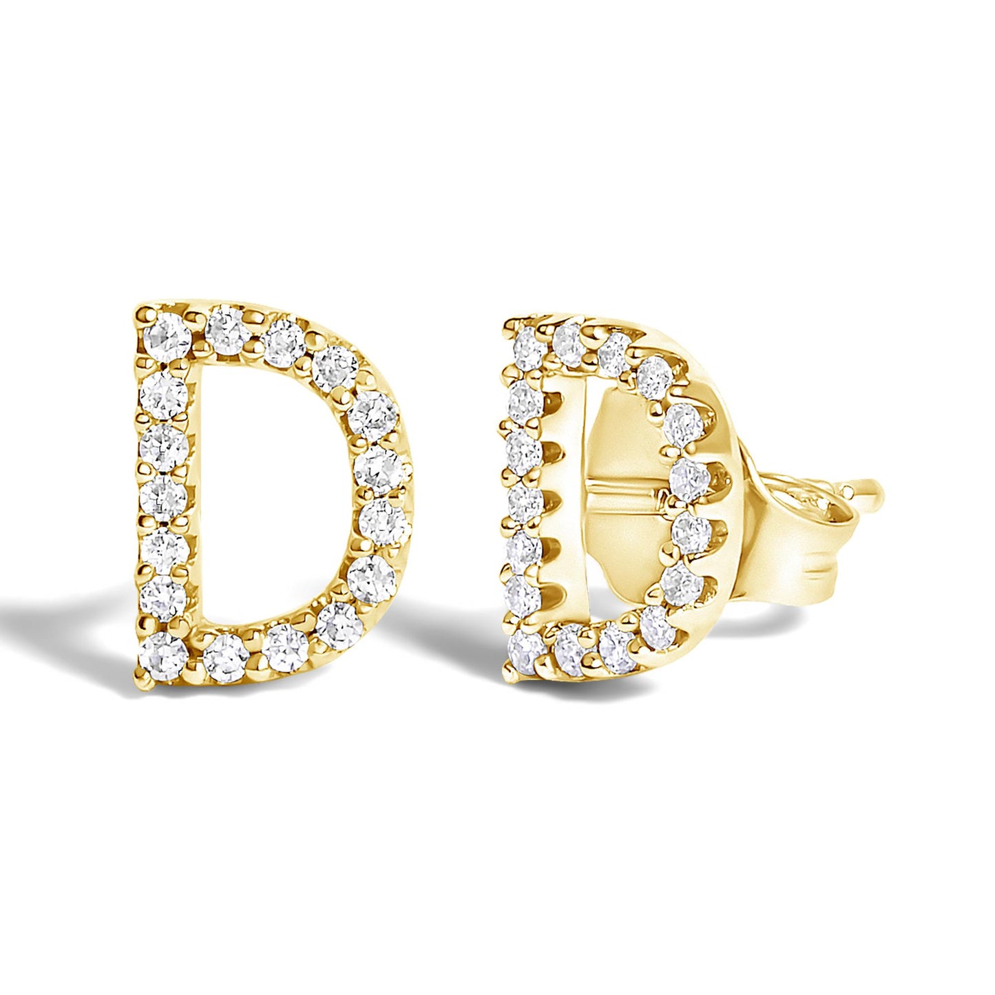 Pair of yellow metal earrings shaped like the letter D, outlined with small round white gemstones, shown from a front and side angle on a white background.