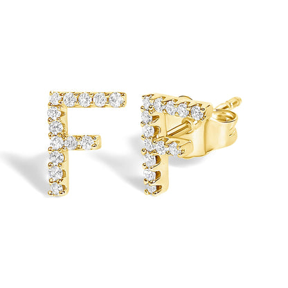 Close-up front and side angle of yellow metal earrings shaped as the letter F, adorned with round white gemstones in a micro-pave setting.