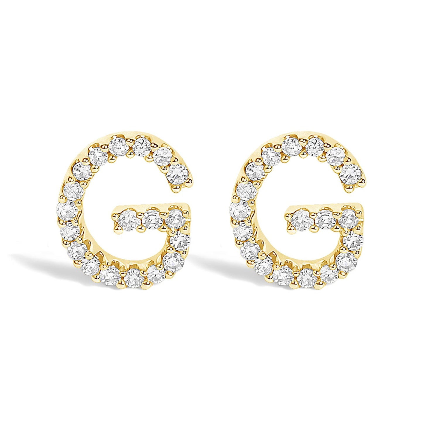 Pair of yellow metal earrings shaped like the letter G, each outlined with round white gemstones in a micro-pave setting, shown from the front angle on a white background.