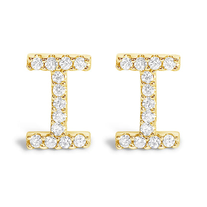 Front view of a pair of yellow metal earrings shaped like the letter 'I,' each adorned with multiple round white gemstones in a micro-pave setting.