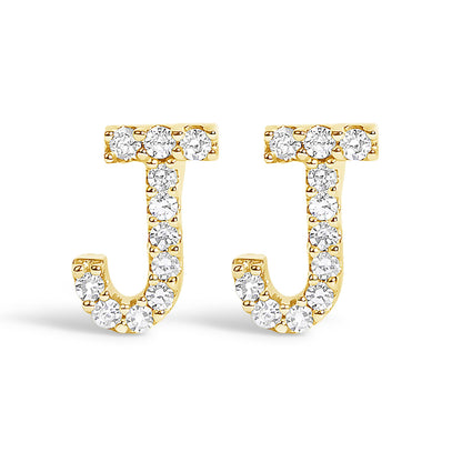 Front view of yellow metal J-shaped earrings adorned with round white gemstones in a micro-pave setting.