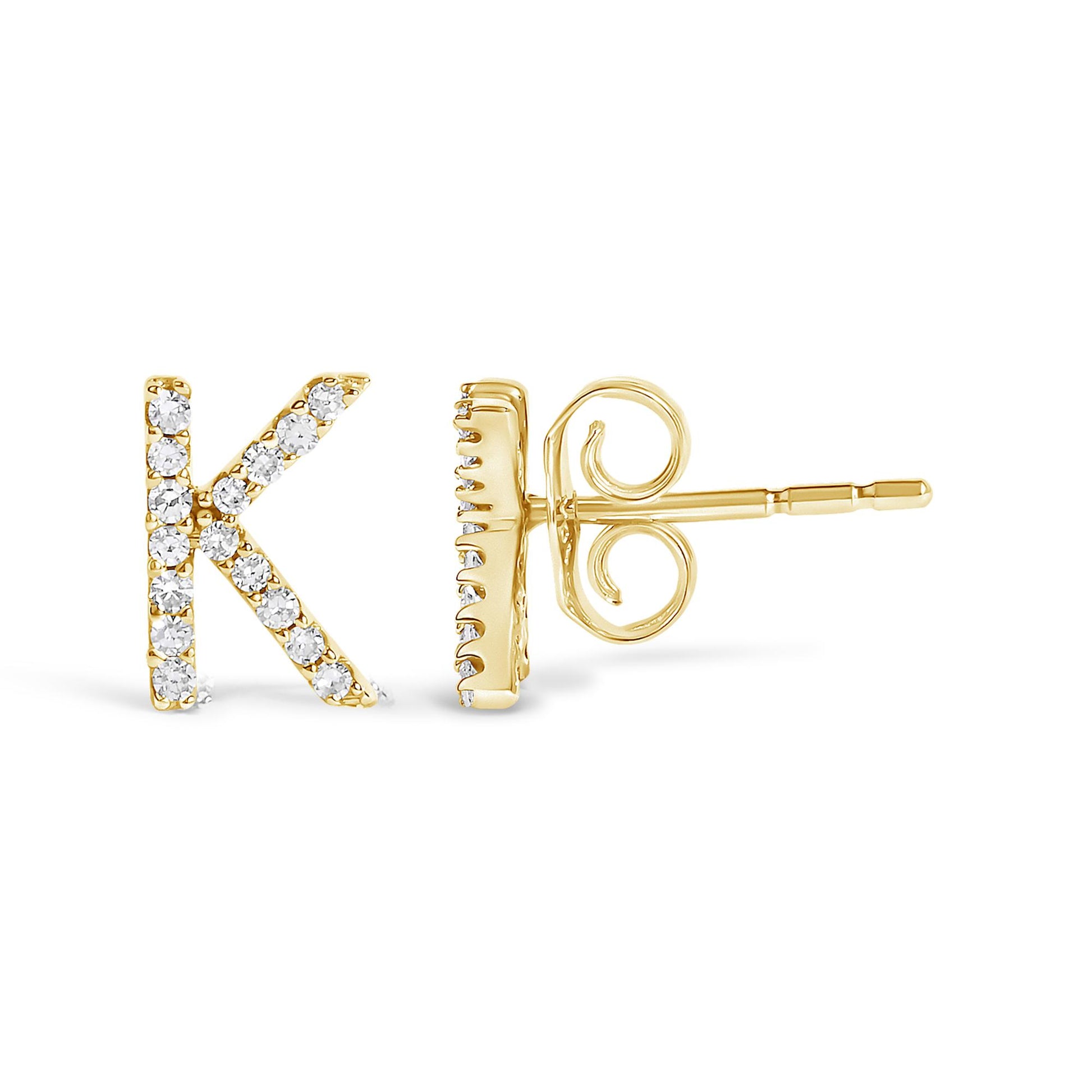 Close-up image of a yellow metal stud earring shaped like the letter K, adorned with small white gemstones in a micro-pave setting, shown from the front and side angles.