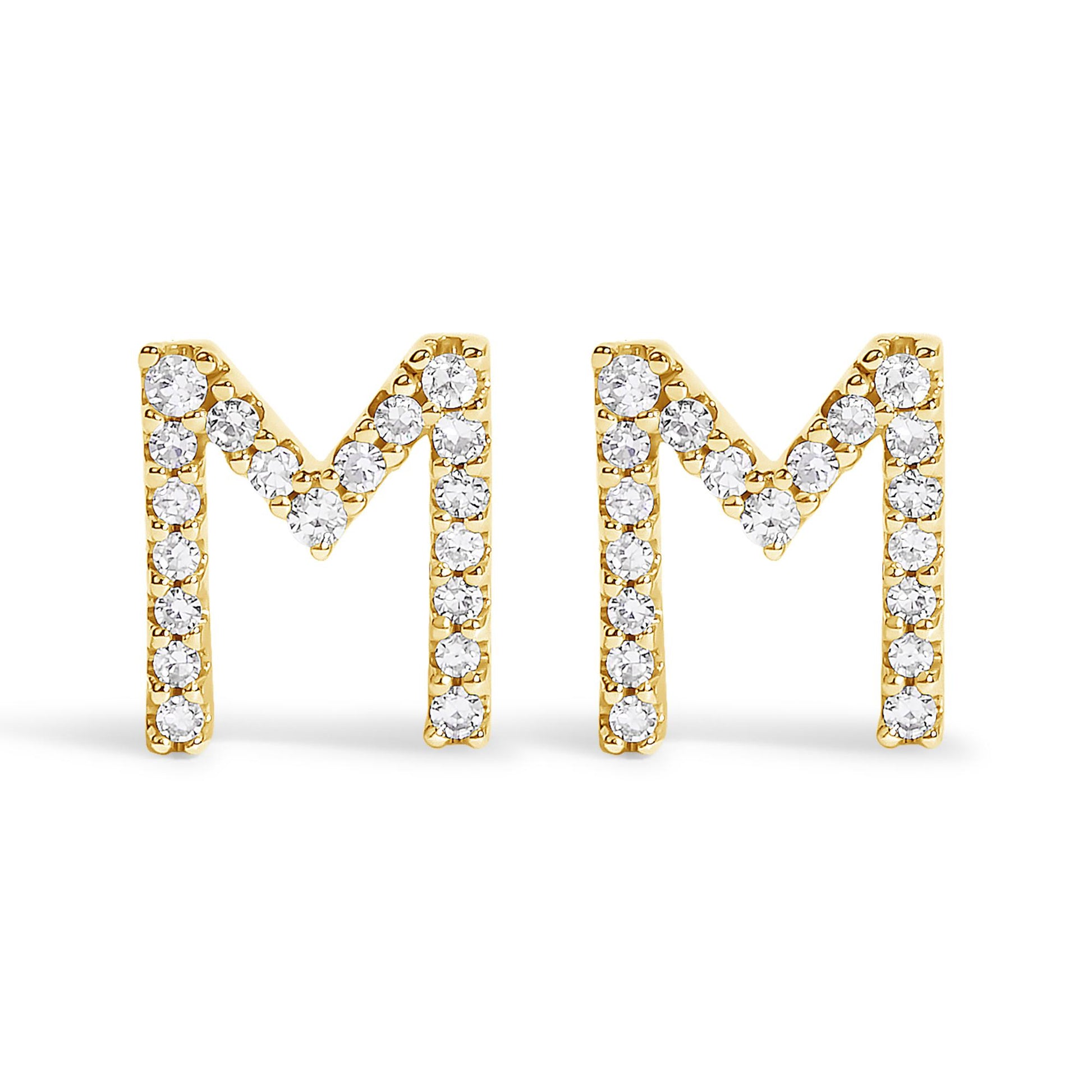 Front-facing view of a pair of yellow metal earrings shaped as the letter 'M,' each adorned with round white gemstones in a micro-pave setting.