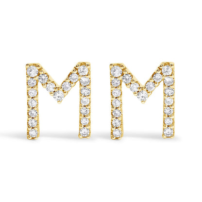 Front-facing view of a pair of yellow metal earrings shaped as the letter 'M,' each adorned with round white gemstones in a micro-pave setting.