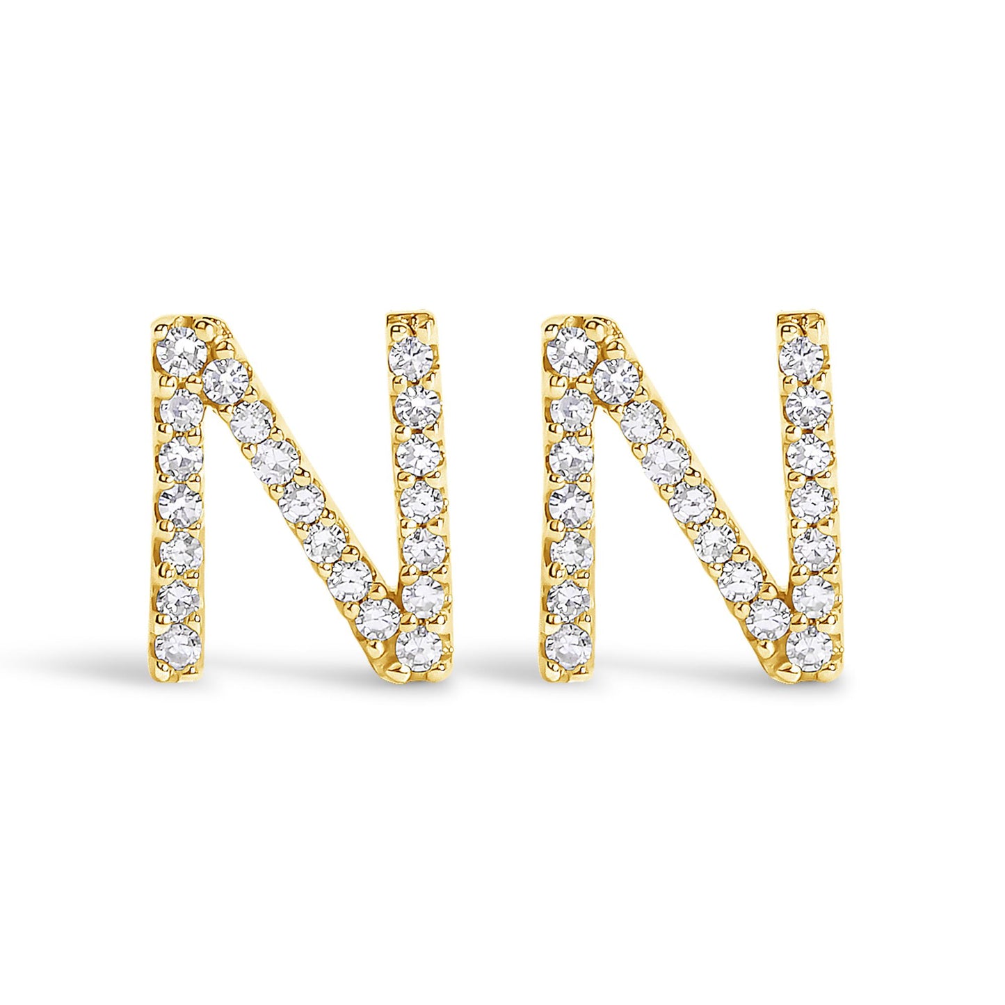 Pair of yellow metal earrings shaped as the letter N, adorned with round white gemstones in a micro-pave setting, shown at a front angle on a white background.