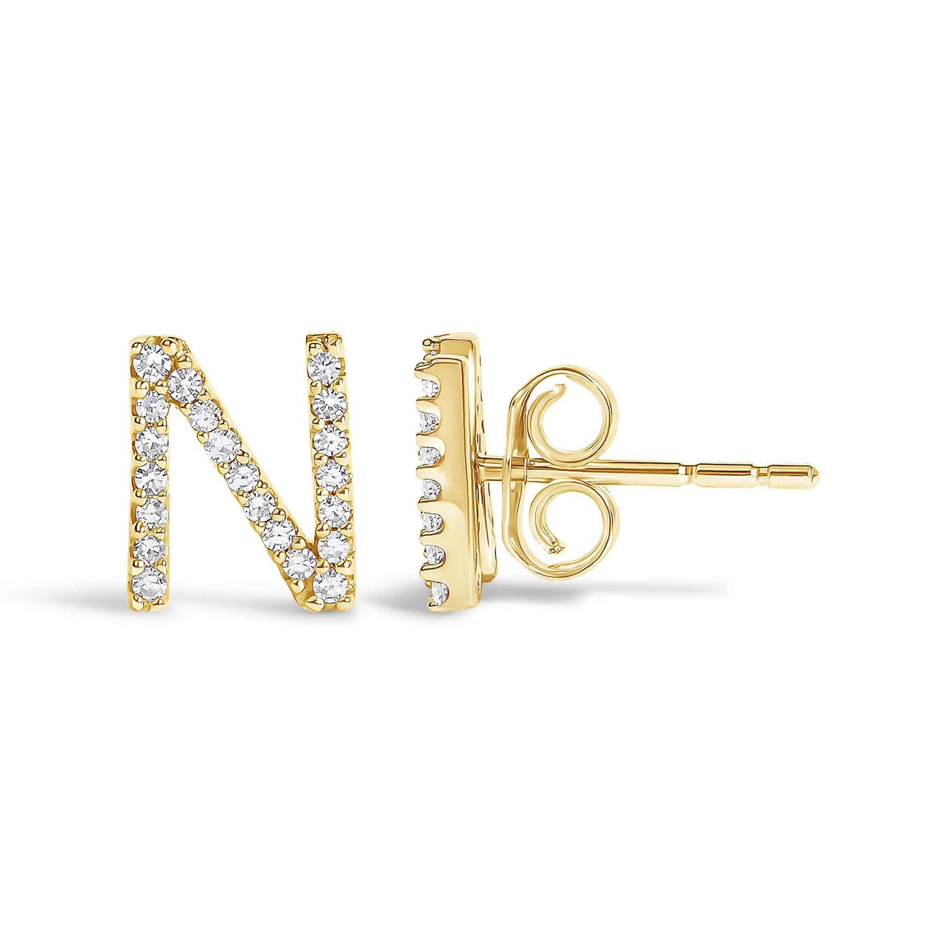 Close-up side angle of a yellow metal stud earring shaped like the letter 'N' with round white gemstones set along the letter, shown on a white background.