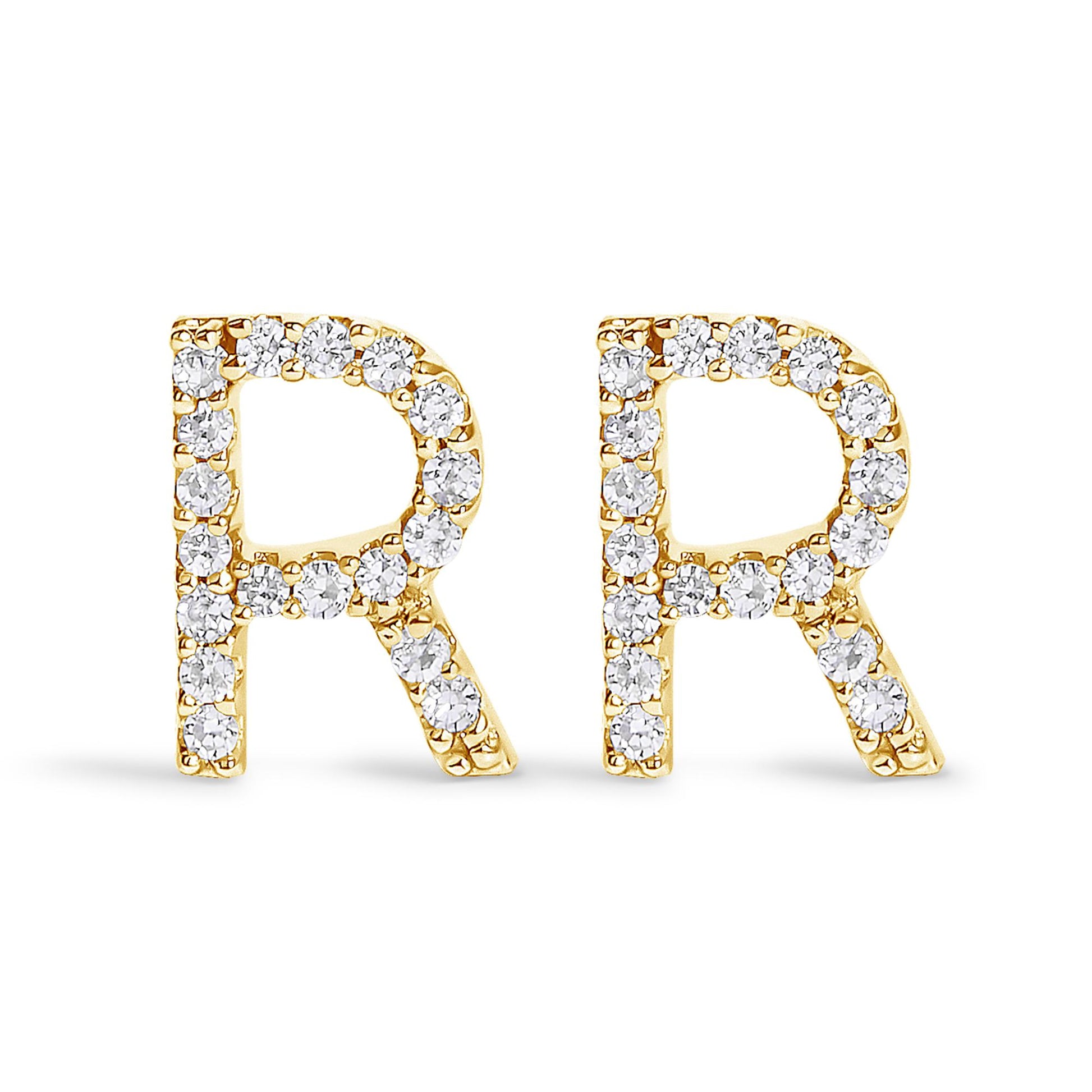Front-facing close-up of a pair of yellow metal earrings shaped as the letter 'R,' each adorned with white round gemstones in a micro-pave setting.