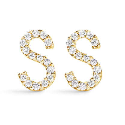 Front view of a pair of yellow metal earrings shaped like the letter 'S,' each adorned with multiple round white gemstones in a micro-pave setting.