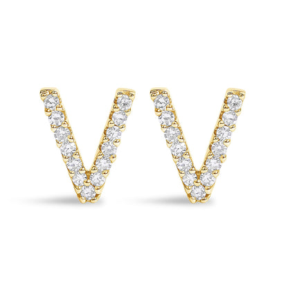 Front-facing shot of a pair of yellow metal earrings shaped like the letter V, each adorned with small round white gemstones in a micro-pave setting.