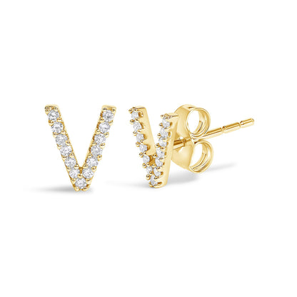 Close-up shot of a pair of yellow metal V-shaped stud earrings, each adorned with small round white gemstones in a micro-pave setting. One earring faces front, and the other shows the side and post.