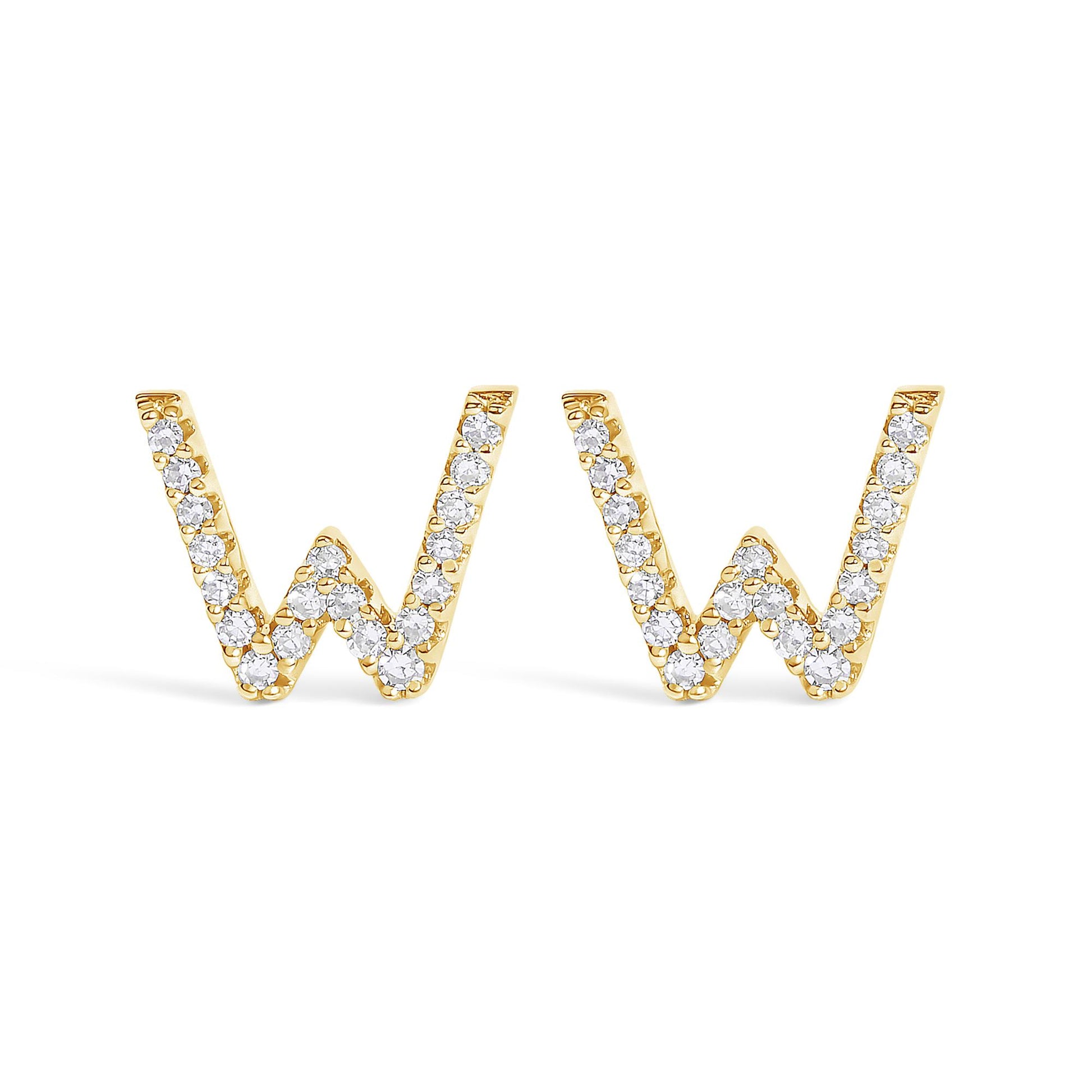 Front-facing shot of a pair of yellow metal earrings shaped like the letter 'W,' each encrusted with small round white gemstones in a micro-pave setting.