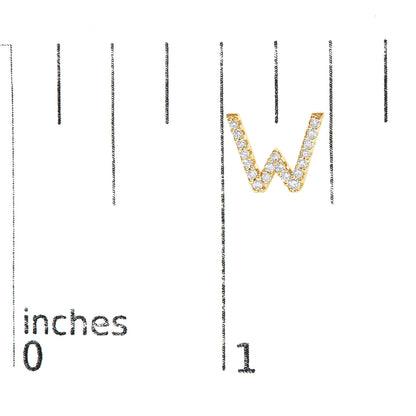 Close-up front view of a yellow metal earring shaped like the letter W, adorned with small round white gemstones in a micro-pave setting, shown on a scale.