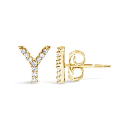 Close-up front and side view of a yellow metal stud earring shaped like the letter Y, set with round white gemstones.