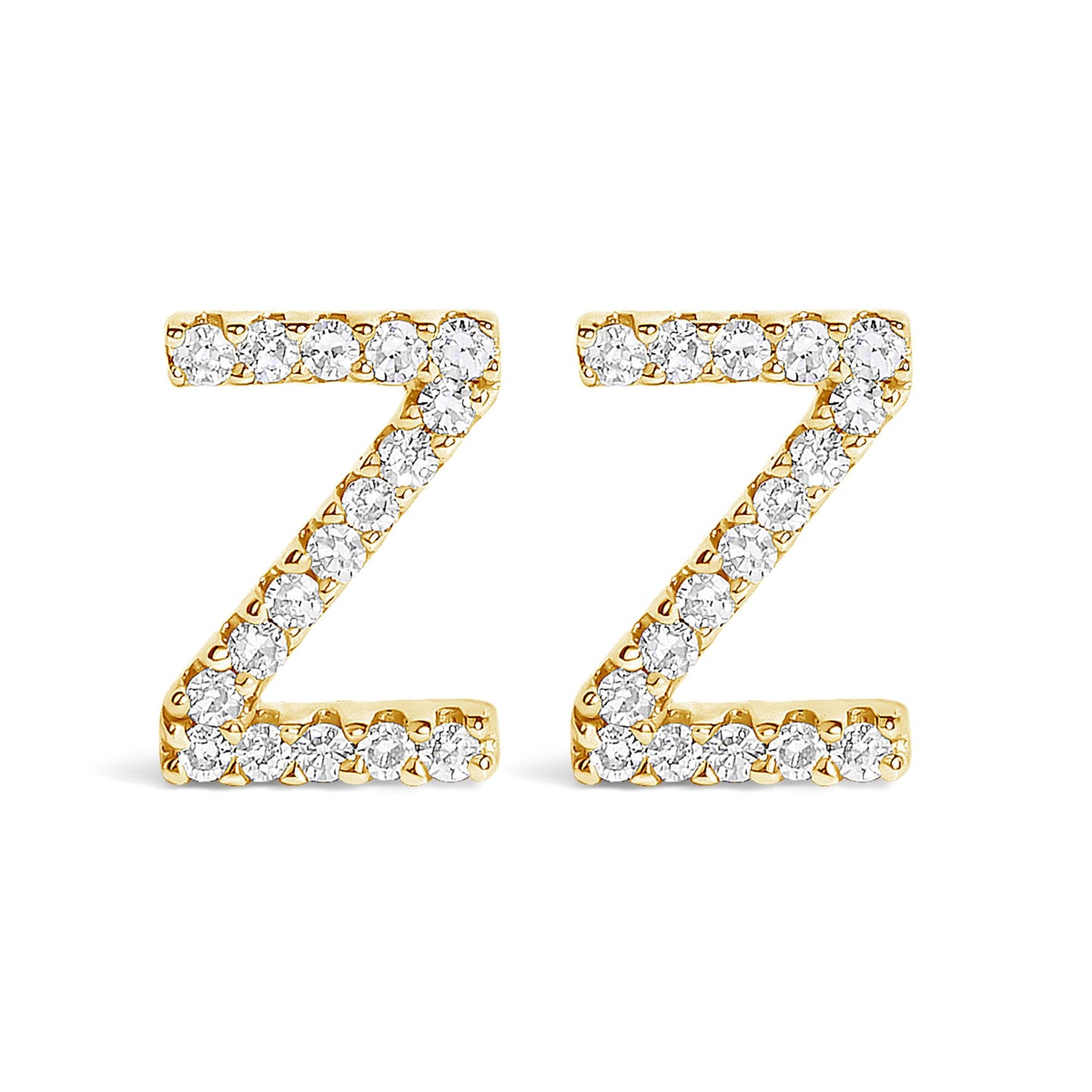 Front view of a pair of yellow metal earrings shaped like the letter Z, each adorned with multiple white round gemstones in a micro-pave setting.