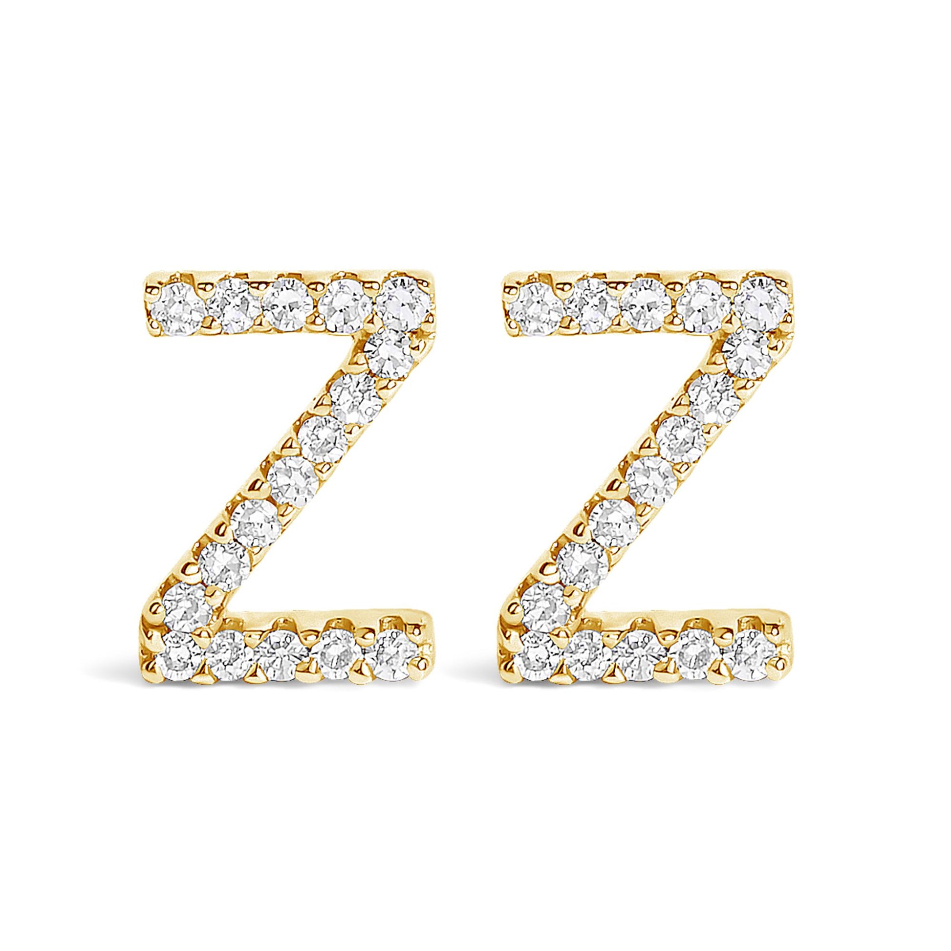 Front view of a pair of yellow metal earrings shaped like the letter Z, each adorned with multiple white round gemstones in a micro-pave setting.