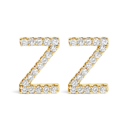 Front view of a pair of yellow metal earrings shaped like the letter Z, each adorned with multiple white round gemstones in a micro-pave setting.