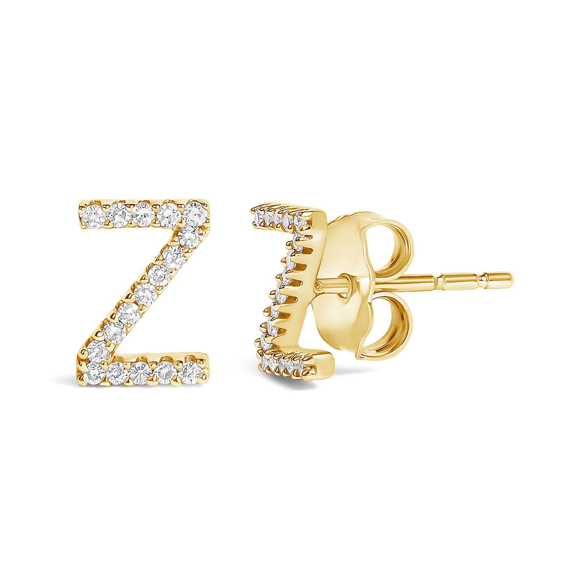 Pair of yellow metal earrings shaped like the letter Z, studded with white round gemstones in a micro-pave setting, shown from a front and side angled view on a white background.