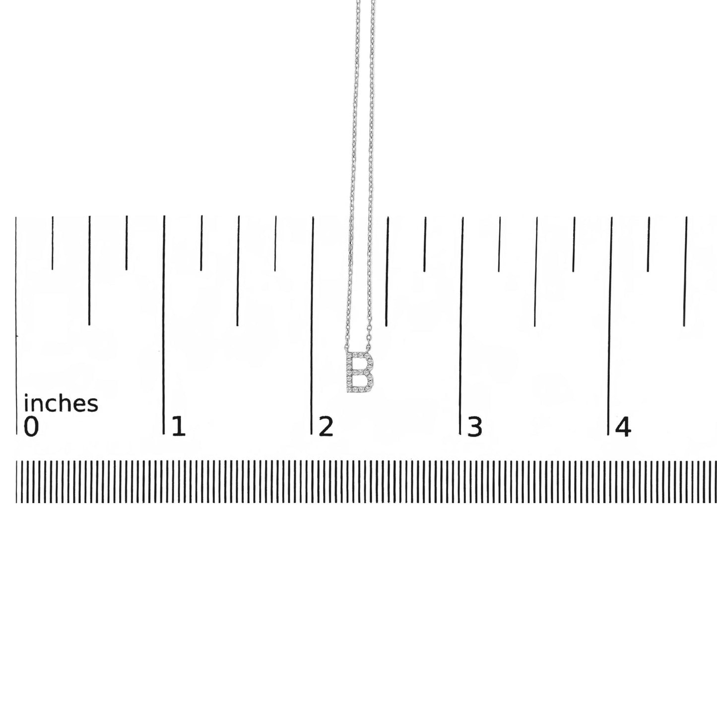 Image showing a white metal necklace with a pendant in the shape of the letter 'B' encrusted with round white gemstones in a micro-pave setting, displayed flat on a scale measuring in inches, shot from a front angle.