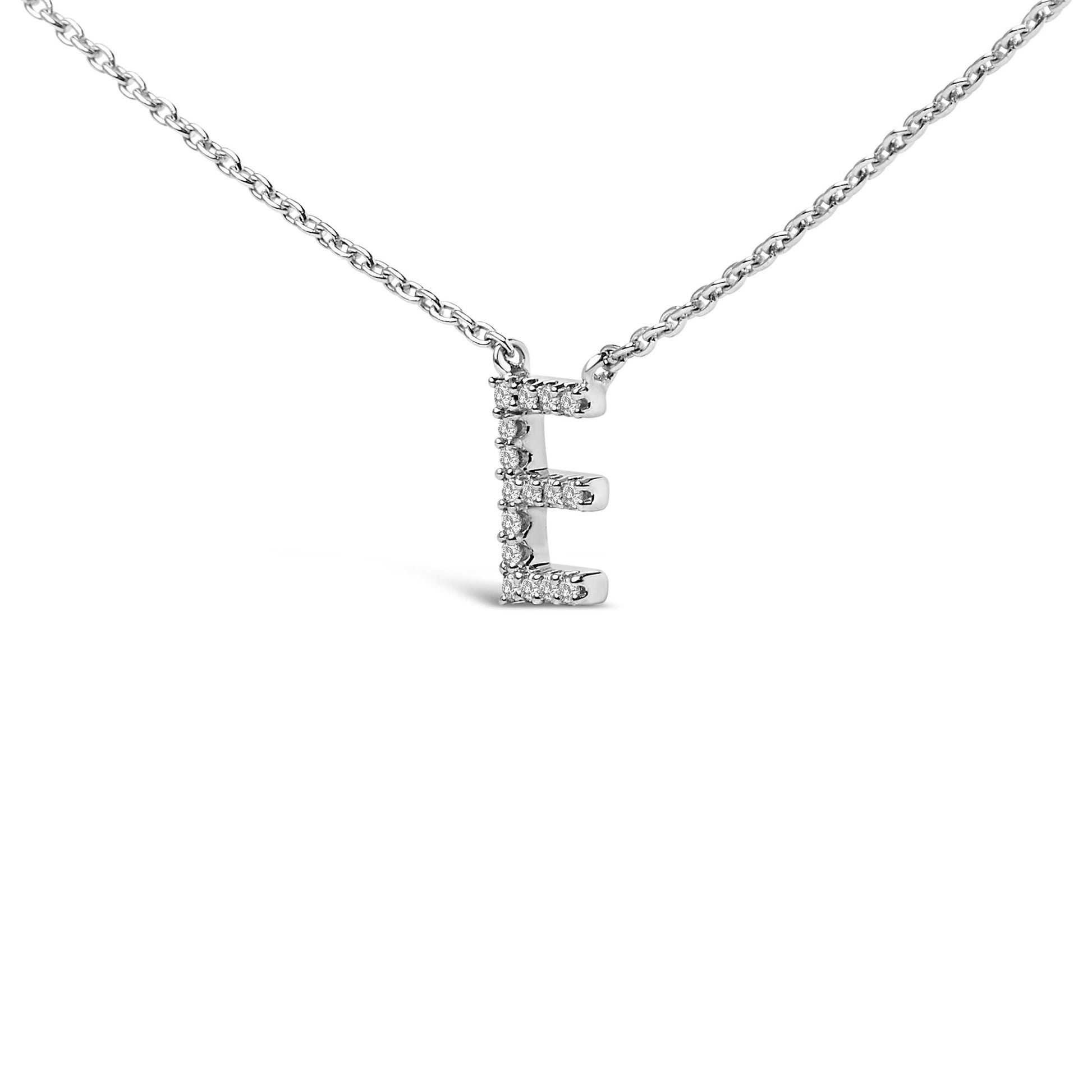 Close-up front view of a white metal necklace with a pendant in the shape of the letter 'E' adorned with white round gemstones in a micro-pave setting.
