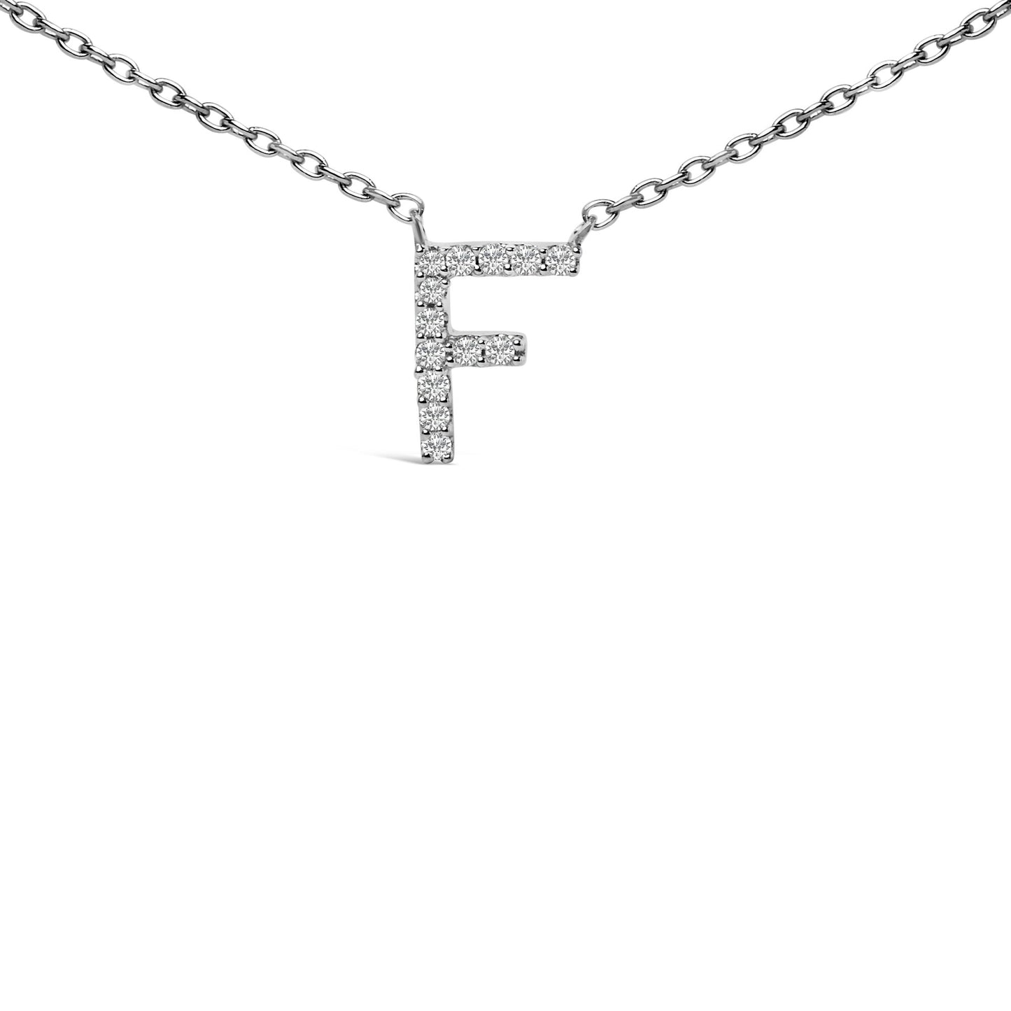 Close-up front angle of a white necklace chain with a pendant shaped as the letter F, adorned with round white gemstones in a micro-pave setting.