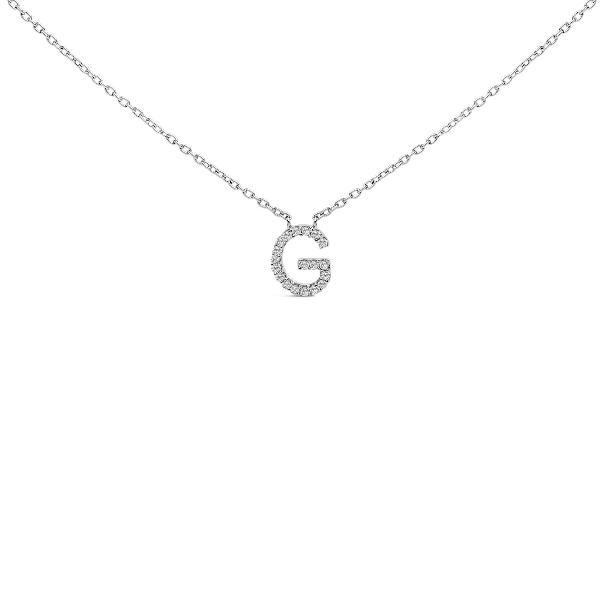 Close-up front view of a white necklace chain with a pendant in the shape of the letter G, featuring round white gemstones in a micro-pave setting.