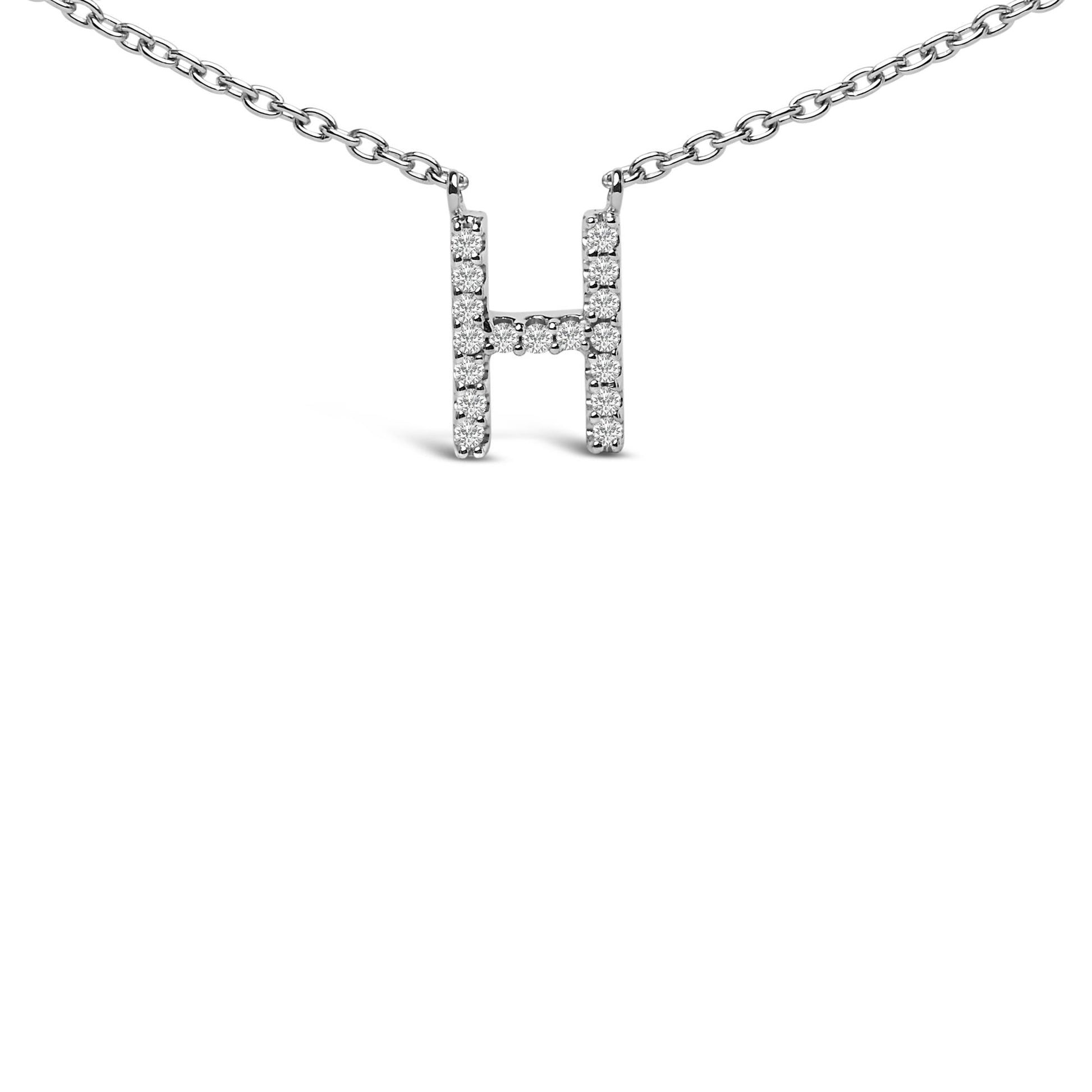 Close-up front view of a white metal necklace with an H-shaped pendant featuring round white gemstones in a micro-pave setting, shown against a white background.