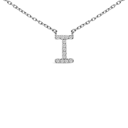 Close-up front view of a white metal necklace with a vertical bar pendant shaped like the letter 'I,' adorned with small round white gemstones in a micro-pave setting along the pendant's surface.