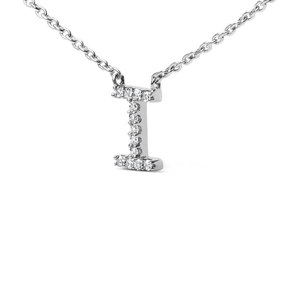 Close-up front view of a white metal necklace pendant in the shape of the letter I, adorned with round white gemstones in a micro-pave setting, shown on a white background.