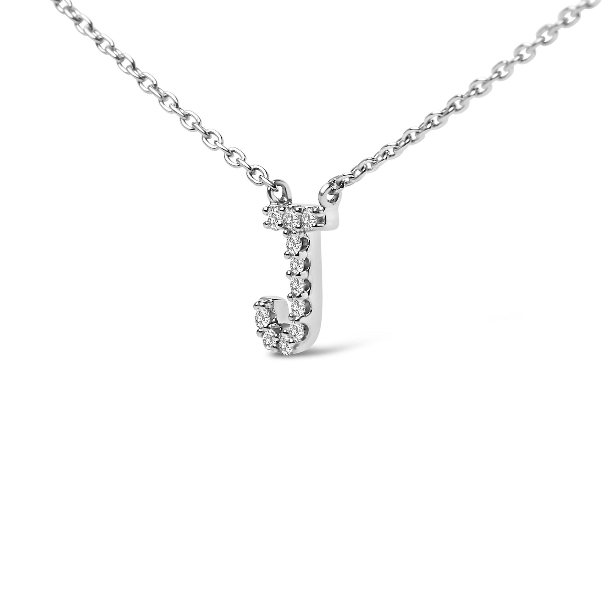 Close-up front view of a white metal necklace pendant shaped like the letter J, adorned with small round white gemstones, shown on a white background.