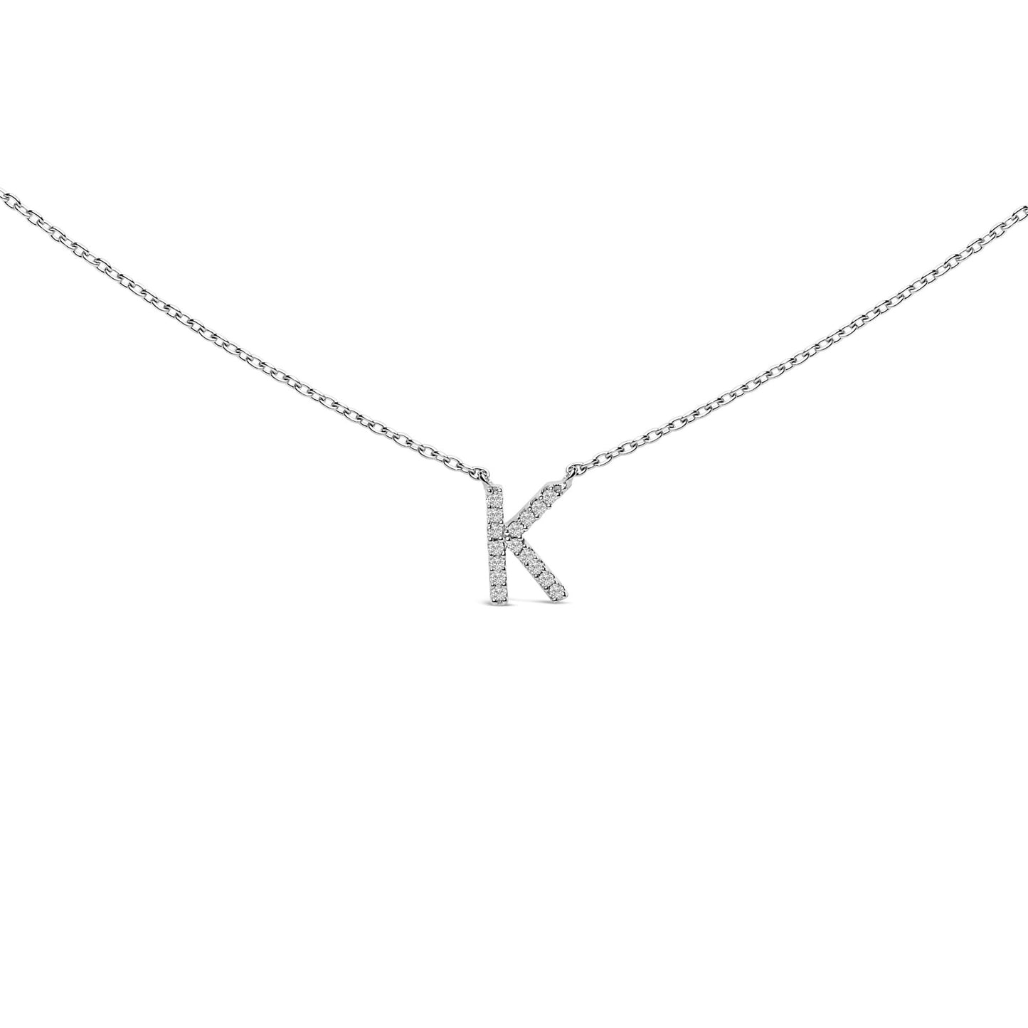 Close-up front view of a white necklace with a pendant shaped like the letter K, featuring round white gemstones in a micro-pave setting, shown against a white background.