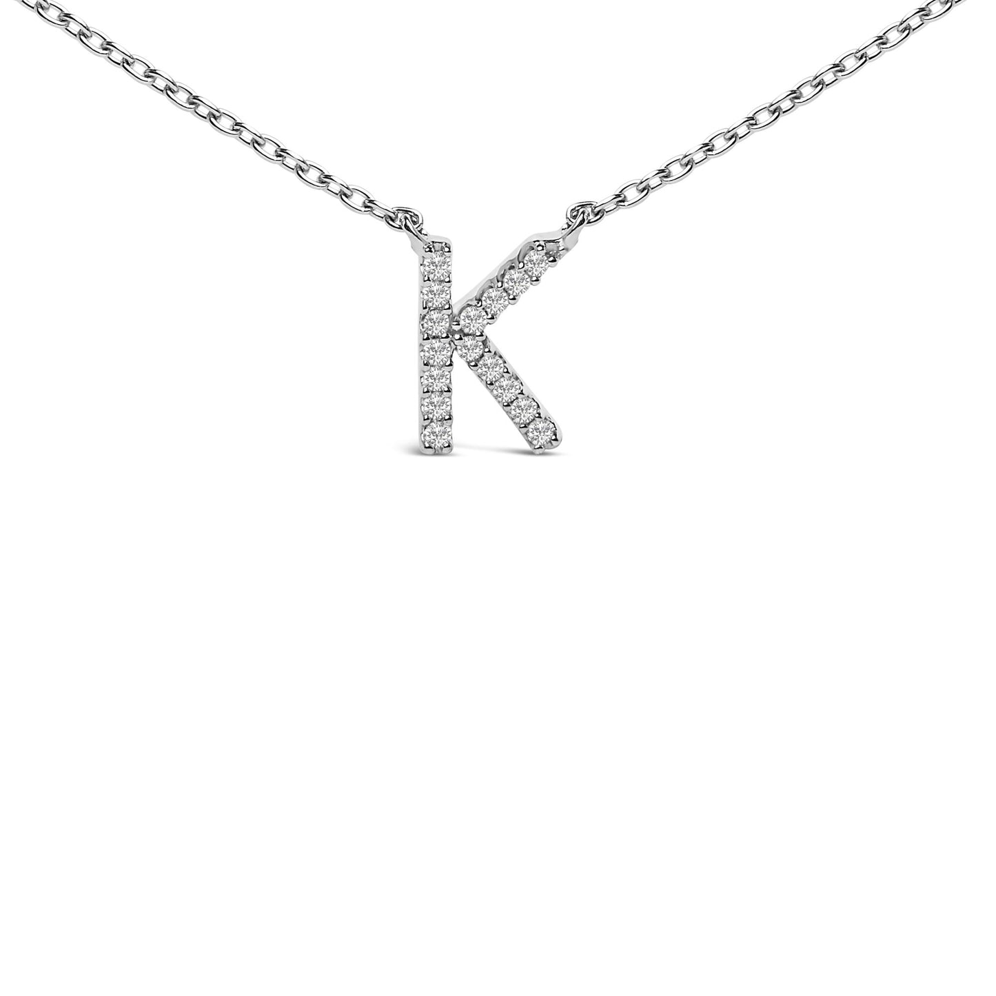 Close-up front view of a white metal necklace chain featuring a pendant in the shape of the letter K, adorned with round white gemstones in a micro-pave setting.
