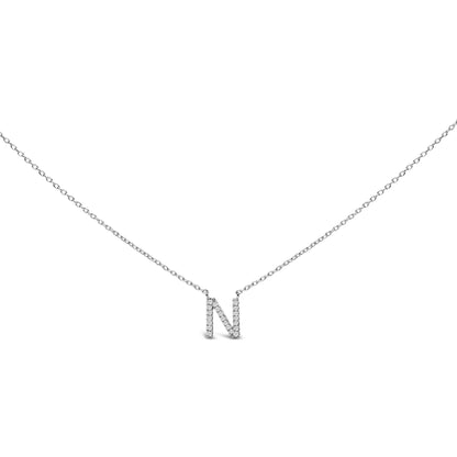 Close-up front view of a white necklace pendant in the shape of the letter 'N' covered with round white gemstones in micro-pave setting, shown against a white background.